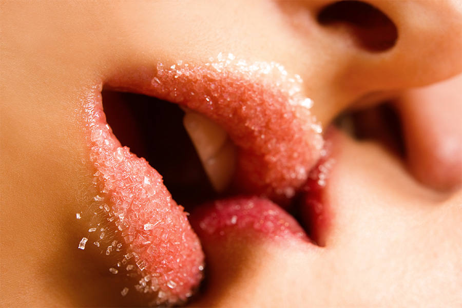 amorette international two ladies lips kissing with sugar on it
