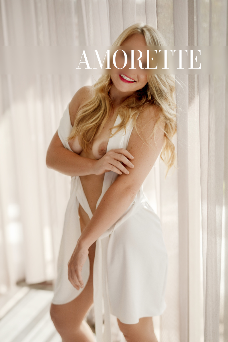 elite escort model ella from berlin shows her natural brests in a white elegant dress
